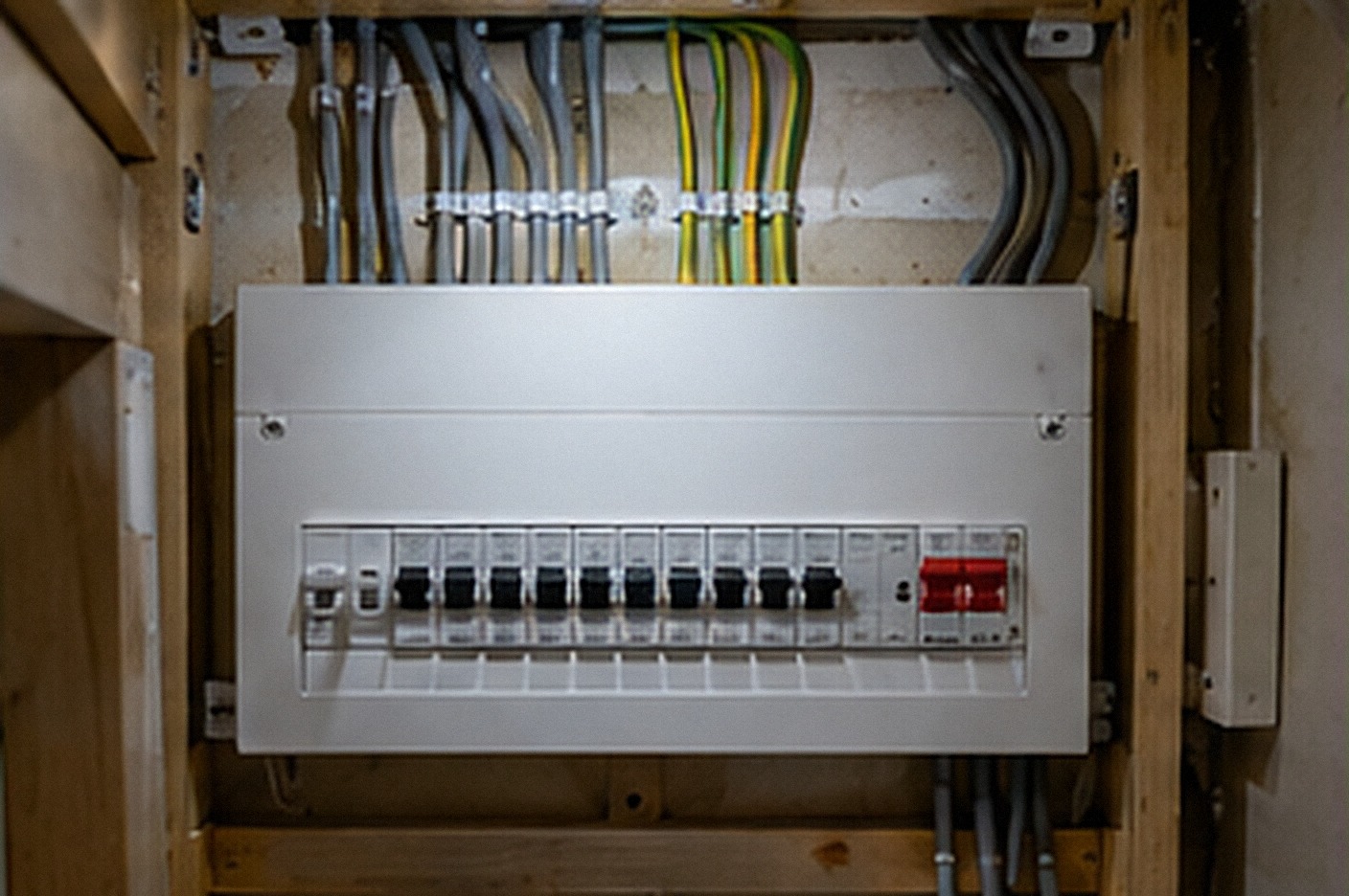 New consumer unit with a neat row of labelled switches fitted to a wall